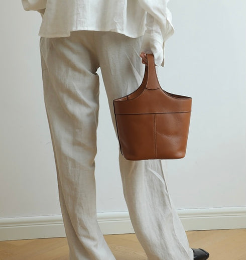 <tc>Elle - Borsa a secchiello fatta a mano in stile minimalista</tc>